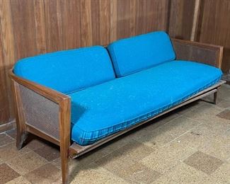 Lot 113 | MID-CENTURY SOFA | Walnut frame with caned back and arms
