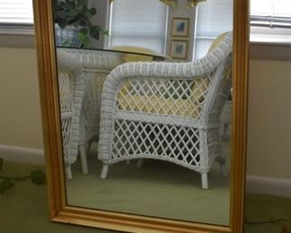 Beautiful Wall Mirror with a perfect reflection of one of the Wicker Chairs showing the design on the side of the chair