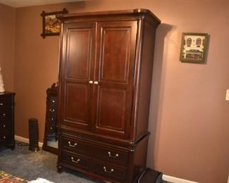 Vintage Armoire with Double Door Top and Bottom. The Armoire matches the Bed, Mirrored Dresser, and matching End Tables.