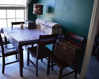 Very Nice Kitchen Table with 4 Matching Chairs also pictured are Decorator Trunks, Wicker Picnic Basket and Table Lamp