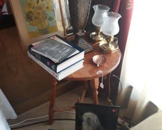 Vintage lamps, occasional table, stool, art, and books.
