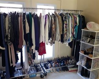Three racks of clothing that includes vintage after 5 and professional work clothing and shoes.
