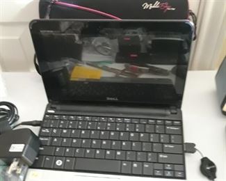 Mini laptop computer. Needs updated software and new battery. Does come with power cord, case, and mouse.