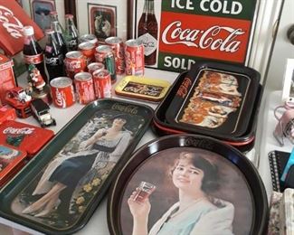 Coca Cola collection of trays, signs, art, bottles, cans, pens sets, matchbox cars, bird house, and more.