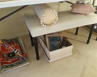 Nice bench, decorative pillows, sheet music, musical recorder and music, Coca Cola rug.