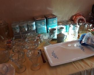 Vintage tin canister set, vintage Corningware tray, and more.