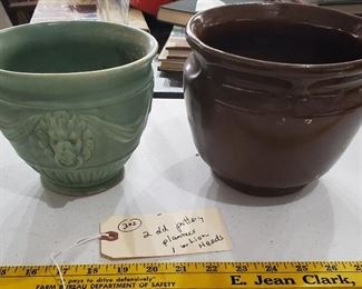 lion head pottery planter and standard brown jardinere