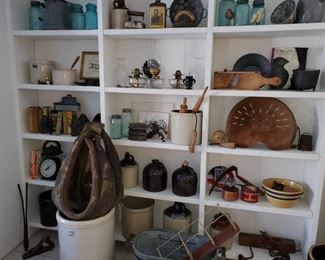 Primitives, tractor seats, blue glass, jugs, crocks, stoneware, horse harness, enamel ware, cast irons, oil wall lamps, oil lanterns,  hanging scale