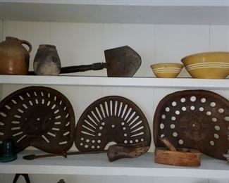 Primitives, tractor seats, blue glass, jugs, crocks, stoneware, horse harness, enamel ware, cast irons, oil wall lamps, oil lanterns,  hanging scale