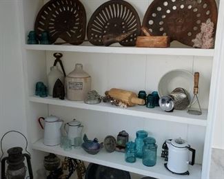 Primitives, tractor seats, blue glass, jugs, crocks, stoneware, horse harness, enamel ware, cast irons, oil wall lamps, oil lanterns,  hanging scale