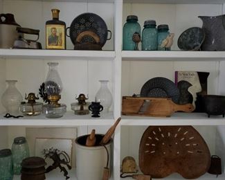 Primitives, tractor seats, blue glass, jugs, crocks, stoneware, horse harness, enamel ware, cast irons, oil wall lamps, oil lanterns,  hanging scale