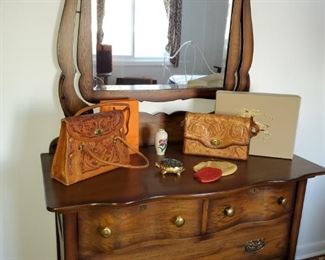 Chest of drawers and mirror,  leather tooled hand bags 