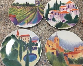 Handpainted plates with European scenes.