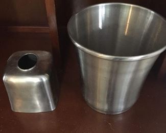 Bathroom tissue holder and wastebasket set.