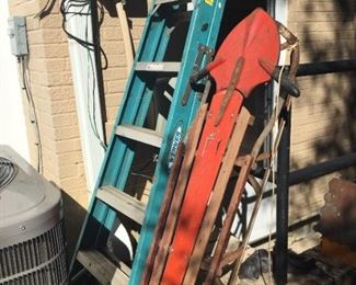 Ladder and vintage sled.
