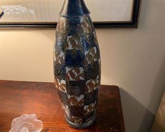 Signed pottery vase $180