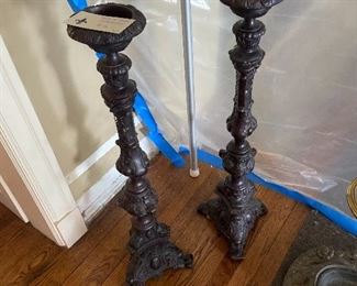 Pair of 36 inches high iron candle sticks. $100