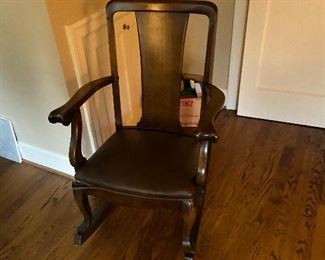 Antique rocker with leather seat good condition - piping needs to reattached on one edge. $80