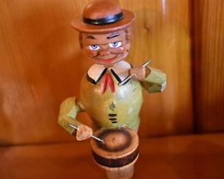 DSC 1515 Vintage ANRI style Mechanical Wooden  Bottle Stopper each Stopper operates similar to a nutcracker, this one plays the drums. These are very difficult to find