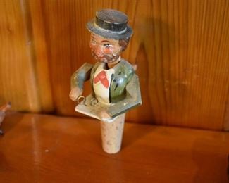 DSC 1518 Vintage ANRI style Mechanical Wooden  Bottle Stopper each Stopper operates similar to a nutcracker, this one puts his glasses on. These are very difficult to find