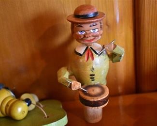 DSC 1514 Vintage ANRI style Mechanical Wooden  Bottle Stopper each Stopper operates similar to a nutcracker, this one plays the drums. These are very difficult to find