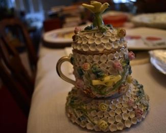 This has got to be very rare. It looks like a "Tea Cup Rose Parade Float!" Delicate Flowers surround the signed Base and the lidded Cup adorned also with Roses and Birds! Gorgeous! I could not find a chip anywhere! The signing is extremely old!