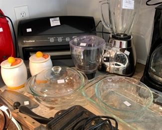 Yes that is a foodsaver, no I don't know if it works, no I don't think we have any bags that go with it, no I don't know what the price is.  Who wants to bet I still get messages asking for the answer to one of the above questions?