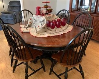 Ok, I rarely actually think this when I see a piece of furniture but I would actually not do a thing to this table.  I love the colors and the style - in fact I literally just painted a table and chair set to look like this, so you know that's high praise about a piece of furniture from me. 