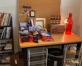 Office-y stuff.  That big plastic coke bottle thing is a bank - not a lamp.  It looks like a lamp because there is a lamp behind it in the picture so it looks like it's all lit up, but it's not. I just don't want anyone to think "wow what a cool lamp" then come to the sale and be like "ah man it's just a bank".  Oh you know what?  You should make it into a lamp.