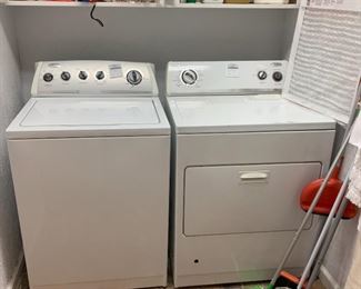 Look, I'm gonna come right out and say it.  I don't like fancy new washer and dryers.  I mean sure they look all sleek and modern, but the functionality just isn't there for me.  Now these babies - top loading washing machine, which is just better for everyone involved who doesn't want wet clothes falling to the floor when you open the door.  And a dryer with a pull down drawer, not only saves your clean clothes from tumbling to floor but it also serves as an extra surface area to stack clothes as you pull them out fold them, because if you're anything like me the top of your dryer is full of random piles of stuff