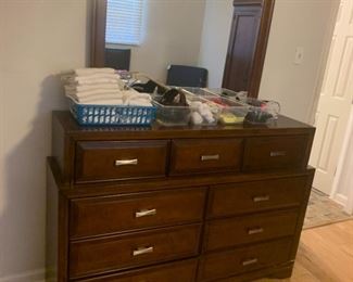 This is a dresser.  It has 9 drawers.  It also has a mirror.  There's seriously not much else to say about it.
