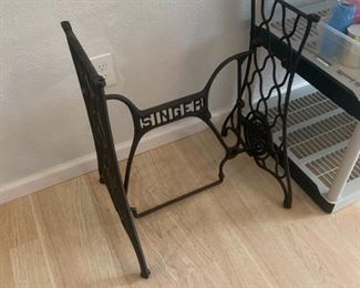 There are many uses for old singer sewing machine bases that aren't tables.  I mean I can't think of any right this second, but I'm sure there are.  Seriously.  