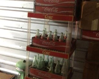 Coca Cola Bottles, wooden cases, vintage raised letter coke bottles, plastic coke stand, sold as package or items individually 
