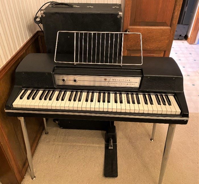 AWESOME WURLITZER MODEL 200A OLD SCHOOL ELECTRIC PIANO WITH SUSTAIN PEDAL & ORIGINAL ROLLING HARDCASE, ALL COMPLETE IN SWEET WORKING CONDITION. DONT MISS OUT ON THIS RARE FIND.