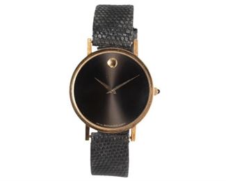 Movado 14k gold quartz wrist watch, marked "7041887, 162298, 14K" on back, with strap
