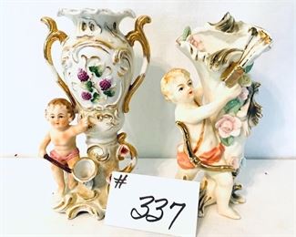 Pair of cherub vases 
some gold loss 8 inches tall $22
