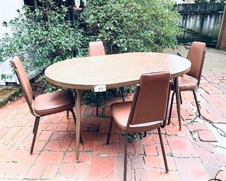 Mid-century modern table and chairs 41.5 wide 60 long $155 
wear on  vinyl chairs