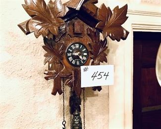 Cuckoo clock  two weights 
9.5 wide 11 tall cracked face
 damage to pendulum $20