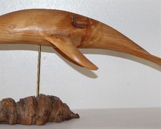 Hand Carved Whale on Burl Wood Stand Signed by Artist J.N. Green 1989. (19”L x 10”H with stand)