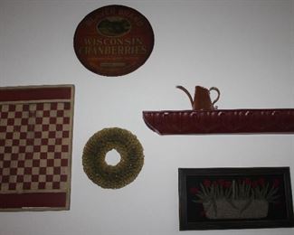Wall Decor: Vintage Beaver Brand Wisconsin Cranberries Barrel Lid Sign (16”D), Replica Red and White Game Board, Vintage Paper Cone Wreath 10 1/2”, Embossed Tin Pediment shelf 31” X 4”) , Butte Copper Co Hammered Watering Can, Vintage Wool Appliqué Tulips Frame (19.5” X 10”)