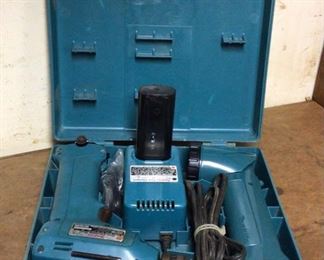Mikita 10mm cordless drill with flashlight and battery charger. Model 6010d