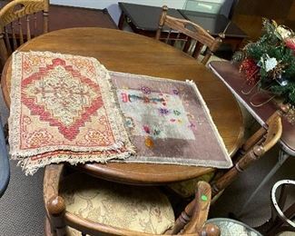 round oak table, 4 chairs, 2 small worn oriental rugs
