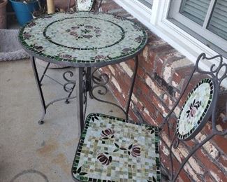 Mosaic tile and iron bistro set.