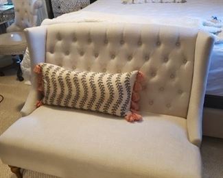 Beautiful modern traditional setee. Just behind the setee is a gorgeous king size bed.