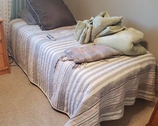 Nice adjustable twin bed, comforter sold separately