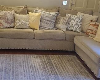 Nice Chenille Upholstered Sectional Sofa with Metal Studs, Outer Accent Pillows sold separately. Area rug and comfy throws sold separately. 