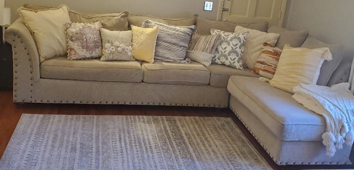 Nice Chenille Upholstered Sectional Sofa with Metal Studs, Outer Accent Pillows sold separately. Area rug and comfy throws sold separately. 