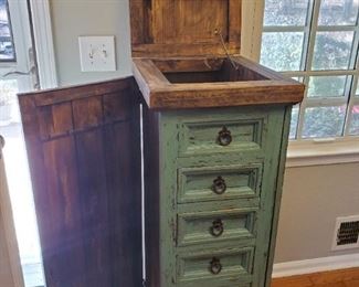 Beautiful Farmhouse Standing Jewelry Chest with Side Panels which Open to Hang Necklaces Inside, Plus Lift Up Mirror Top with Storage Compartment, Full Front of Storage Drawers. Lovely Distressed Aqua Color.