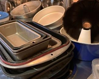 various kitchen items, cookie sheets, loaf pans, Bundt pans, etc