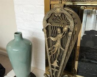 floor vase and brass fireplace fan screen